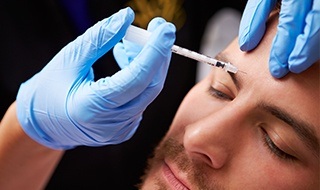 Man receiving Botox injection