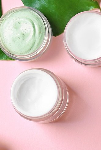 Three jars of skin care products