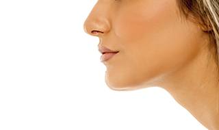 An up-close image of a women’s profile with a focus on her nose, mouth, and chin areas