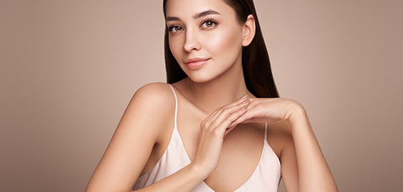 Portrait of beautiful woman against neutral backdrop