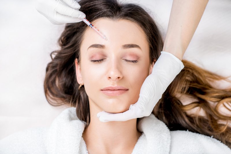 a young woman receiving Botox