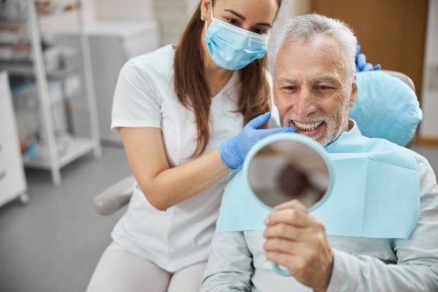 Happy man getting BOTOX injection.